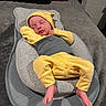 Oaklynn is registered to the contest to win money with this photo: baby, baby_seat, blanket, closed_eyes, clothing, cozy, cushion, feet, furniture, gray_background, hands, indoors, infant, newborn, peaceful, photography, portrait, sleeping, yellow_hat, yellow_outfit