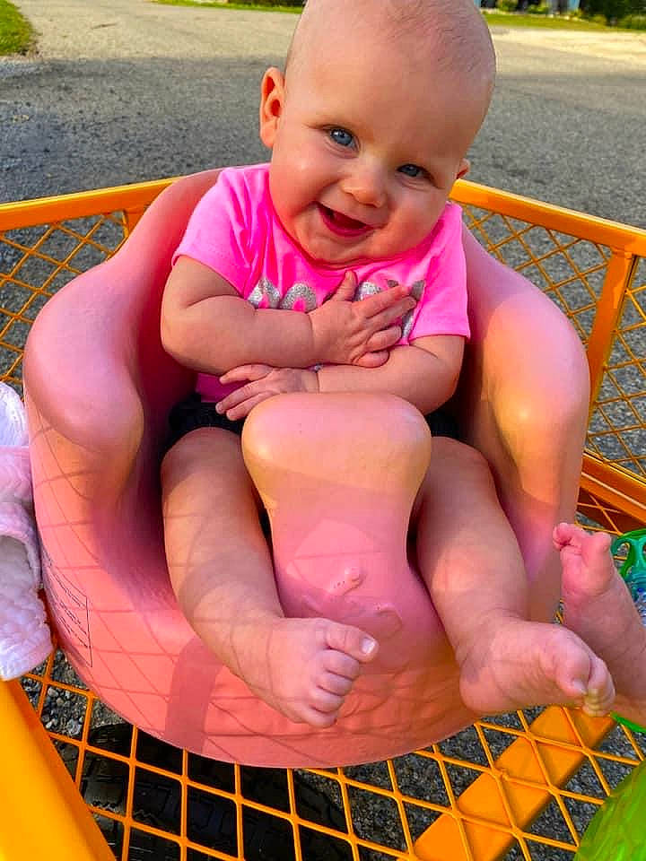 Ensley is registered to the contest to win money with this photo: baby, child, fun, games, grass, leisure, lip, mouth, person, pink, play, recreation, sitting, skin, summer, toddler, vacation