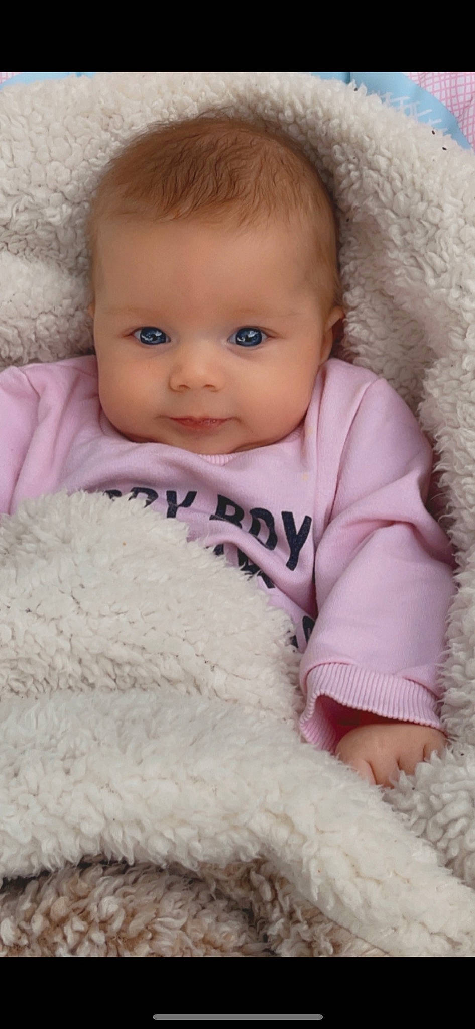 Brooklyn is registered to the contest to win money with this photo: baby_toddler_clothing, cheek, comfort, eyebrow, eyelash, iris, lip, mammal, nose, organ, outerwear, person, photograph, pink, product, skin, sleeve, smile, textile, toddler