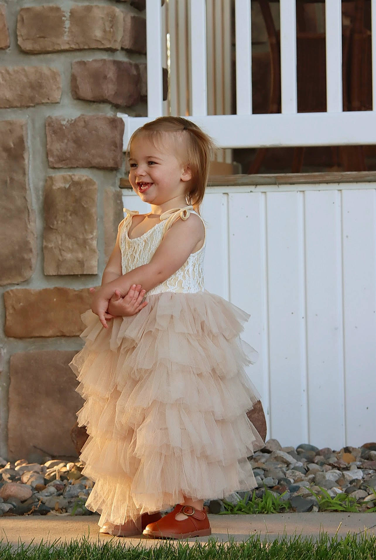Hanna is registered to the contest to win money with this photo: blond, bridal_accessory, bridal_clothing, bridal_party_dress, clothing, dress, event, facial_expression, flash_photography, formal_wear, gown, hairstyle, happy, joy, one_piece_garment, person, plant, shoulder, smile, toddler