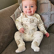Frankie is registered to the contest to win money with this photo: baby, bodypart, chair, clothing, couch, cushion, face, finger, furniture, hand, happy, head, homedecor, hosiery, pants, person, photography, portrait, sitting, sock