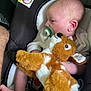 baby, infant, car_seat, pacifier, plush_toy, stuffed_animal, deer, child, cute, sleepy, soft_toy, comfort, infant_clothing, newborn, resting, tiny_feet, close_up, indoors, peaceful, baby_care