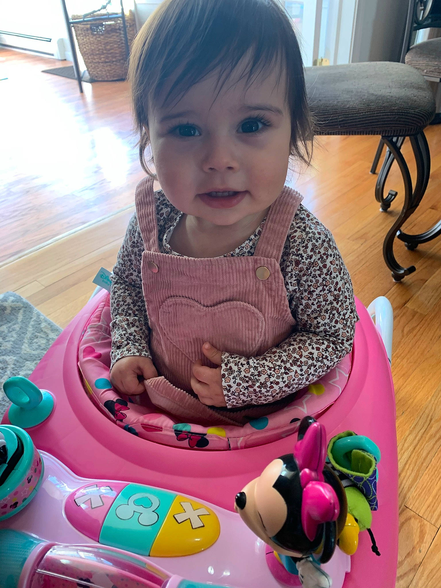 Olivia is registered to the contest to win money with this photo: baby, baby_products, baby_toddler_clothing, cheek, child, cool, fun, green, happy, leisure, organ, person, pink, recreation, riding_toy, sitting, skin, smile, toddler, toy