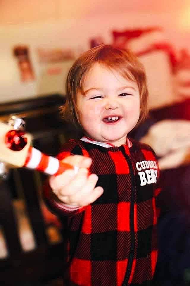 Ashleigh joined the competition — help win amazing prizes! cheek, child, christmas, design, face, facial_expression, fun, happy, holiday, joy, pattern, person, photography, plaid, red, smile, tartan, textile, toddler
