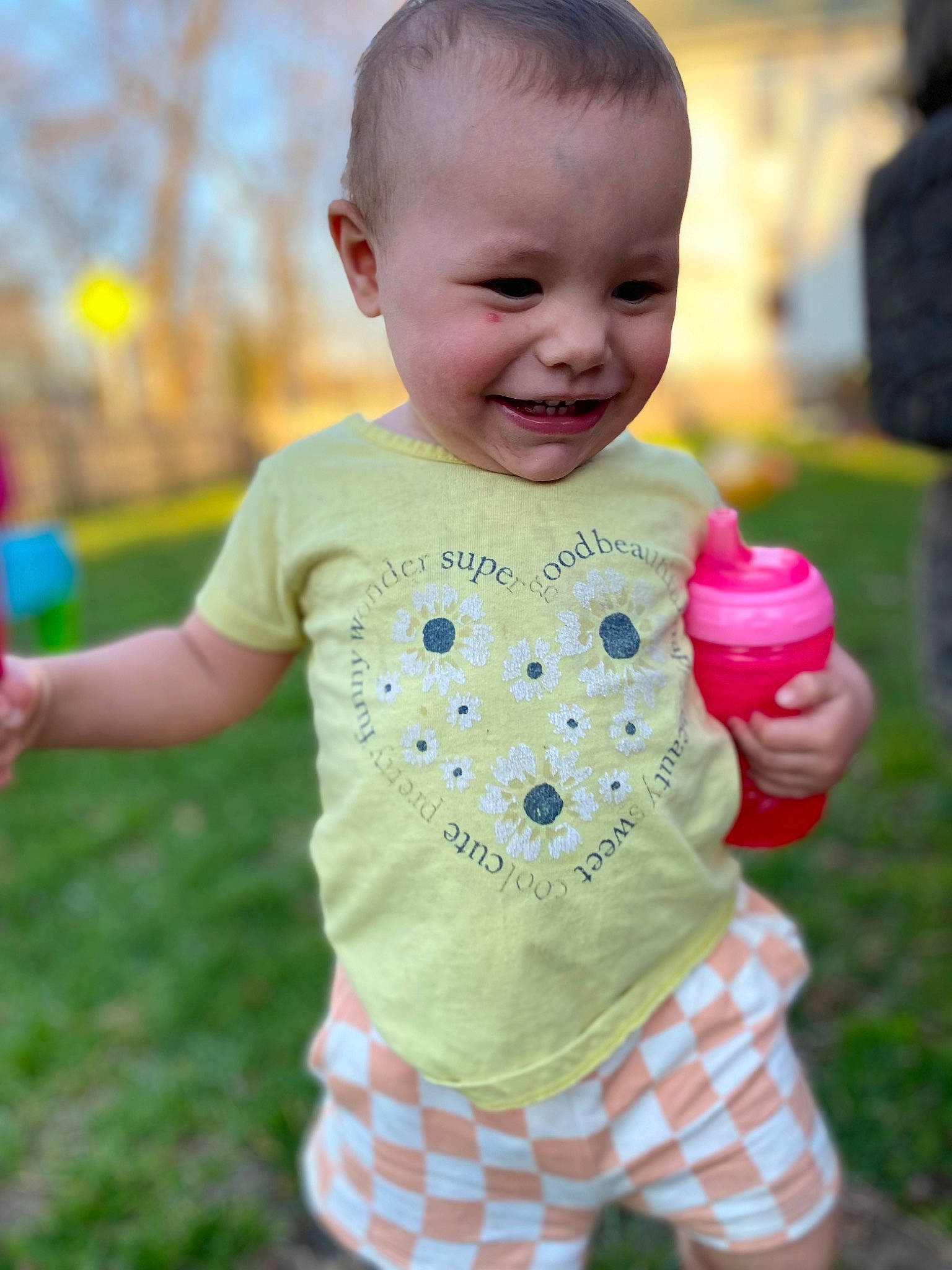 Aleah joined the competition — help win amazing prizes! baby, baby_toddler_clothing, child, facial_expression, fun, gesture, grass, happy, joy, leisure, pattern, people_in_nature, person, pink, play, recreation, skin, sleeve, smile, t_shirt