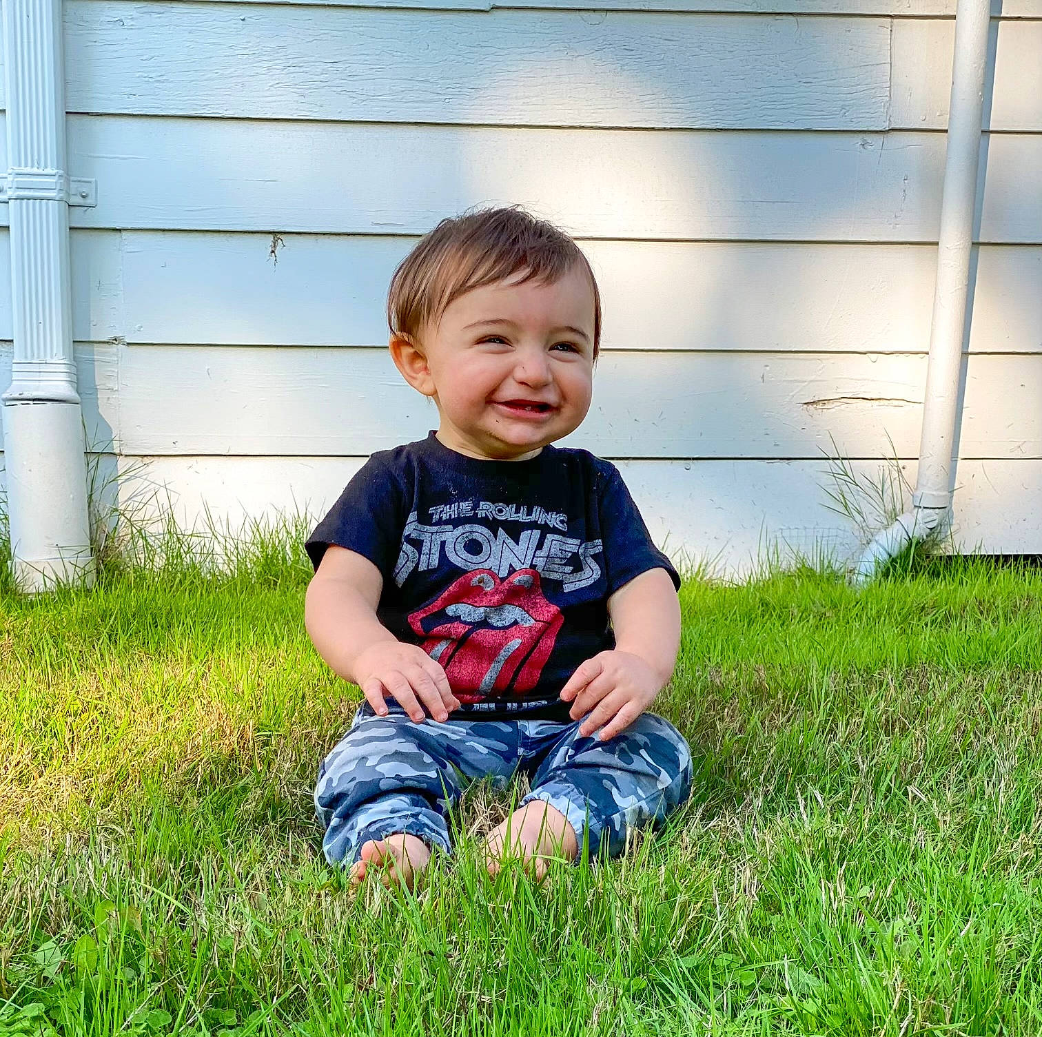 Jagger is registered to the contest to win money with this photo: child, facial_expression, family, fun, grass, grass_family, happy, joy, lawn, meadow, people, person, photography, plant, play, sitting, smile, summer, toddler, tree