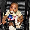 baby, pacifier, stroller, striped, beaded_necklace, cup, sock, clothing, child, infant, seated, black, white, cute, curious, indoor, person, portrait, graco, expression