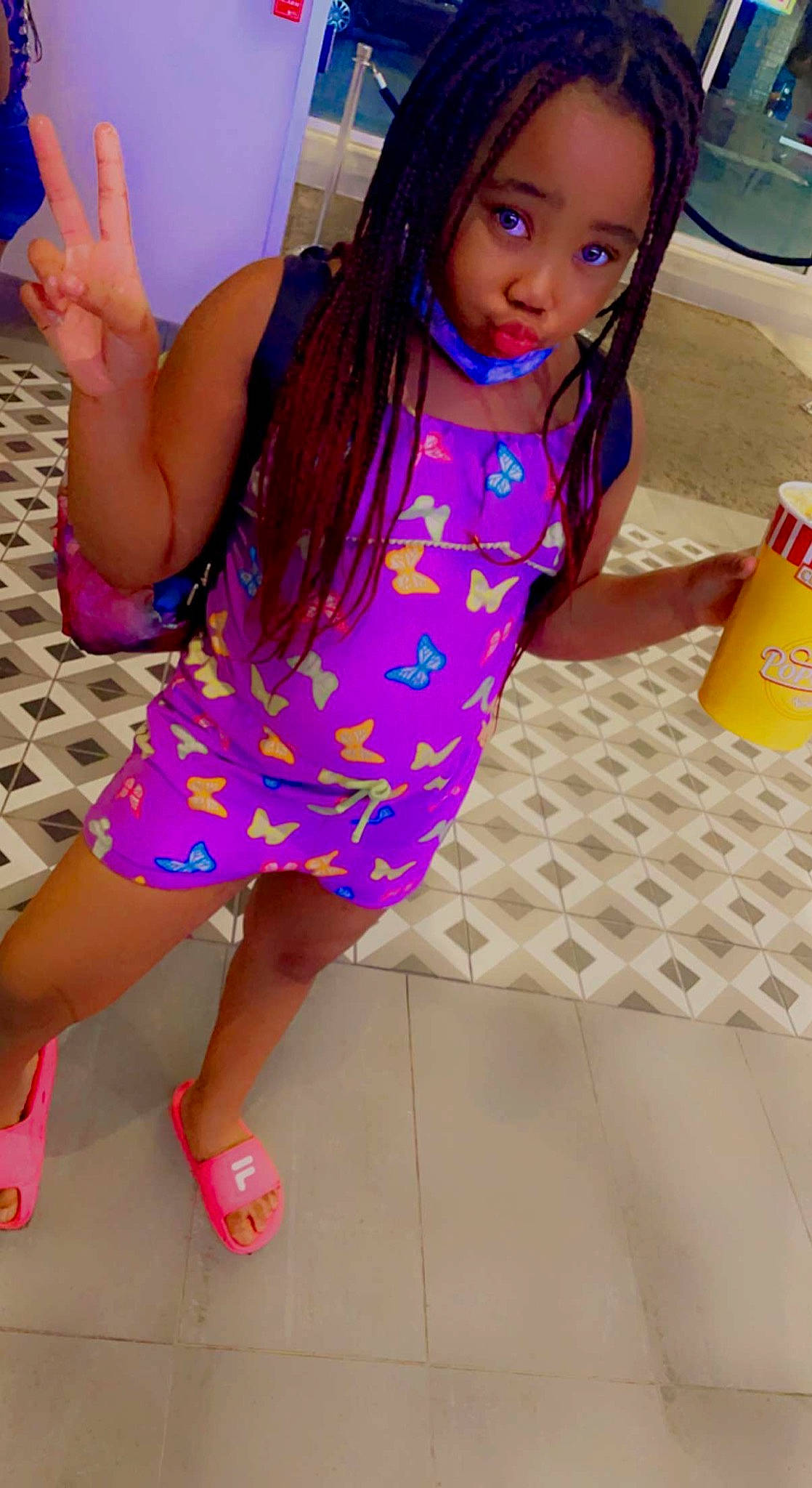 Kyionna is registered to the contest to win money with this photo: black_hair, child, dress, eye, fun, hair, happy, head, joint, leg, leisure, magenta, one_piece_garment, person, pink, purple, sandal, skin, thigh, thumb