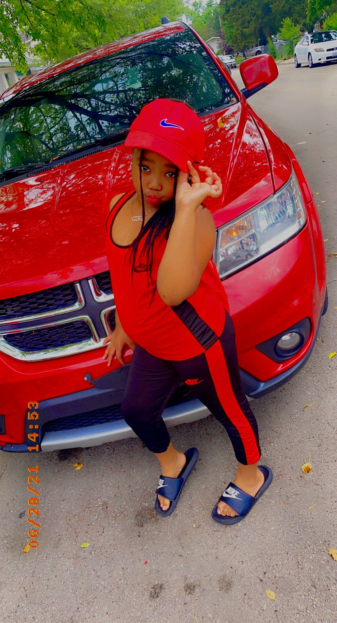 Kyionna joined the competition — help win amazing prizes! alloy_wheel, automotive_design, automotive_exterior, automotive_lighting, automotive_tire, automotive_wheel_system, bumper, car, fender, grille, headlamp, hood, land_vehicle, leg, motor_vehicle, person, red, rim, vehicle, vehicle_door