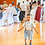 Mayron participe au concours pour gagner de l'argent avec cette photo : toddler, child, boy, indoor, party, people, floor, suspenders, bowtie, walking, blurred_background, event, dress, shoes, light, portrait, focus, happy, cute, fashion