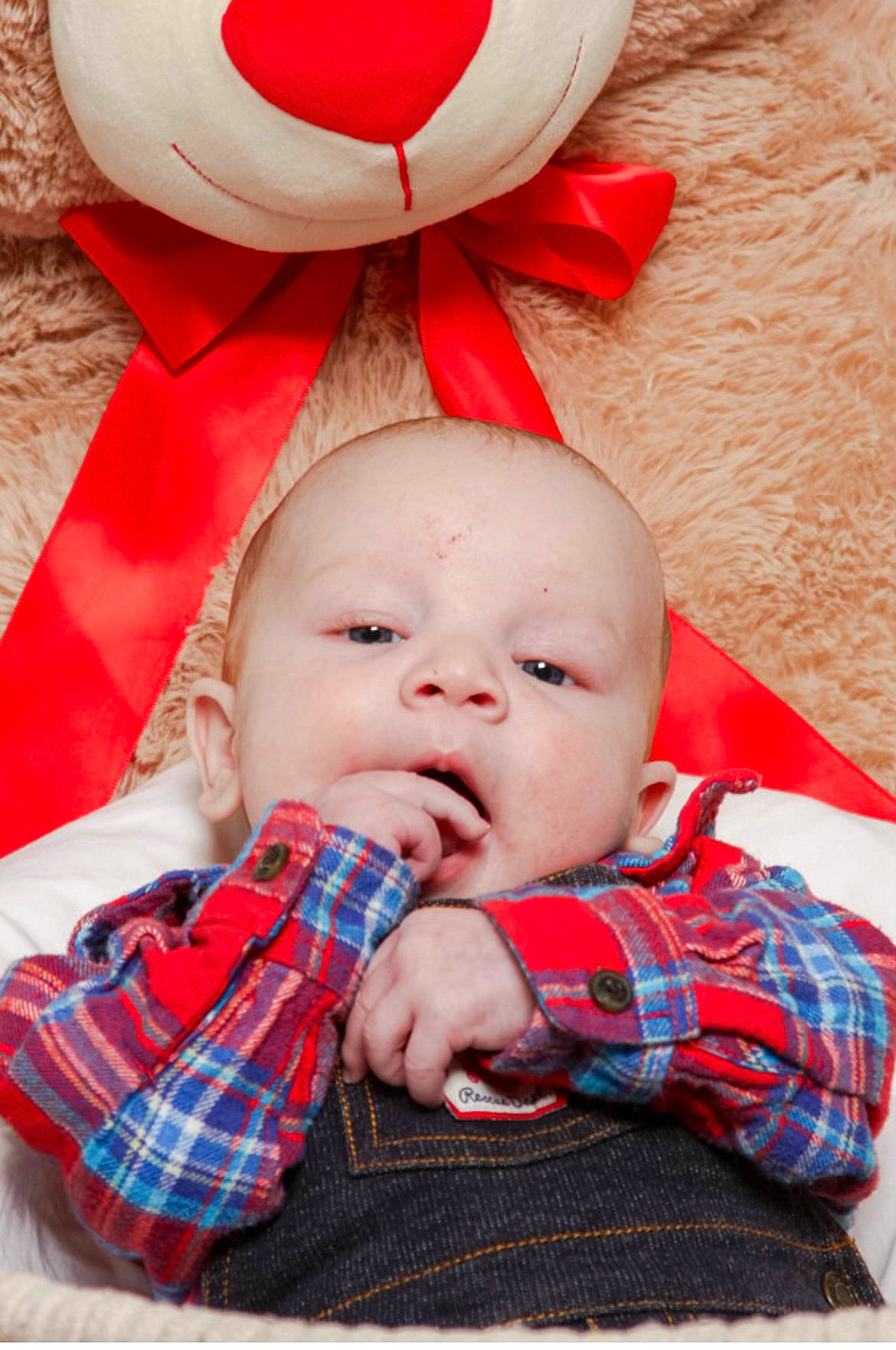 Finnley joined the competition — help win amazing prizes! baby, baby_toddler_clothing, cheek, child, chin, comfort, design, happy, head, nose, pattern, person, pink, plaid, red, skin, sleeve, tartan, textile, toddler
