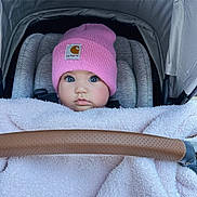 Kennedy is registered to the contest to win money with this photo: baby, beanie, bed, bonnet, cap, car, clothing, cradle, crib, face, furniture, hat, head, infantbed, newborn, person, photography, portrait, transportation, vehicle