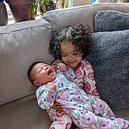 Patience joined the competition — help win amazing prizes! baby, child, toddler, pajamas, couch, smile, laughing, curly_hair, plants, indoor, cozy, cushion, family, sibling, love, happy, home, cute, infant, portrait