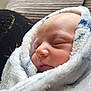 baby, newborn, sleeping, blanket, soft_texture, wrapped, face, closeup, peaceful, infant, cozy, indoor, portrait, child, cute, resting, cushion, warm, skin, head