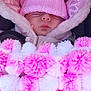 Andie is registered to the contest to win money with this photo: baby, sleeping, pink_hat, blanket, pom_poms, cozy, winter_clothing, hood, child, cute, soft_texture, knitwear, bundle, wrapped, warm, infant, face, close_up, resting, car_seat