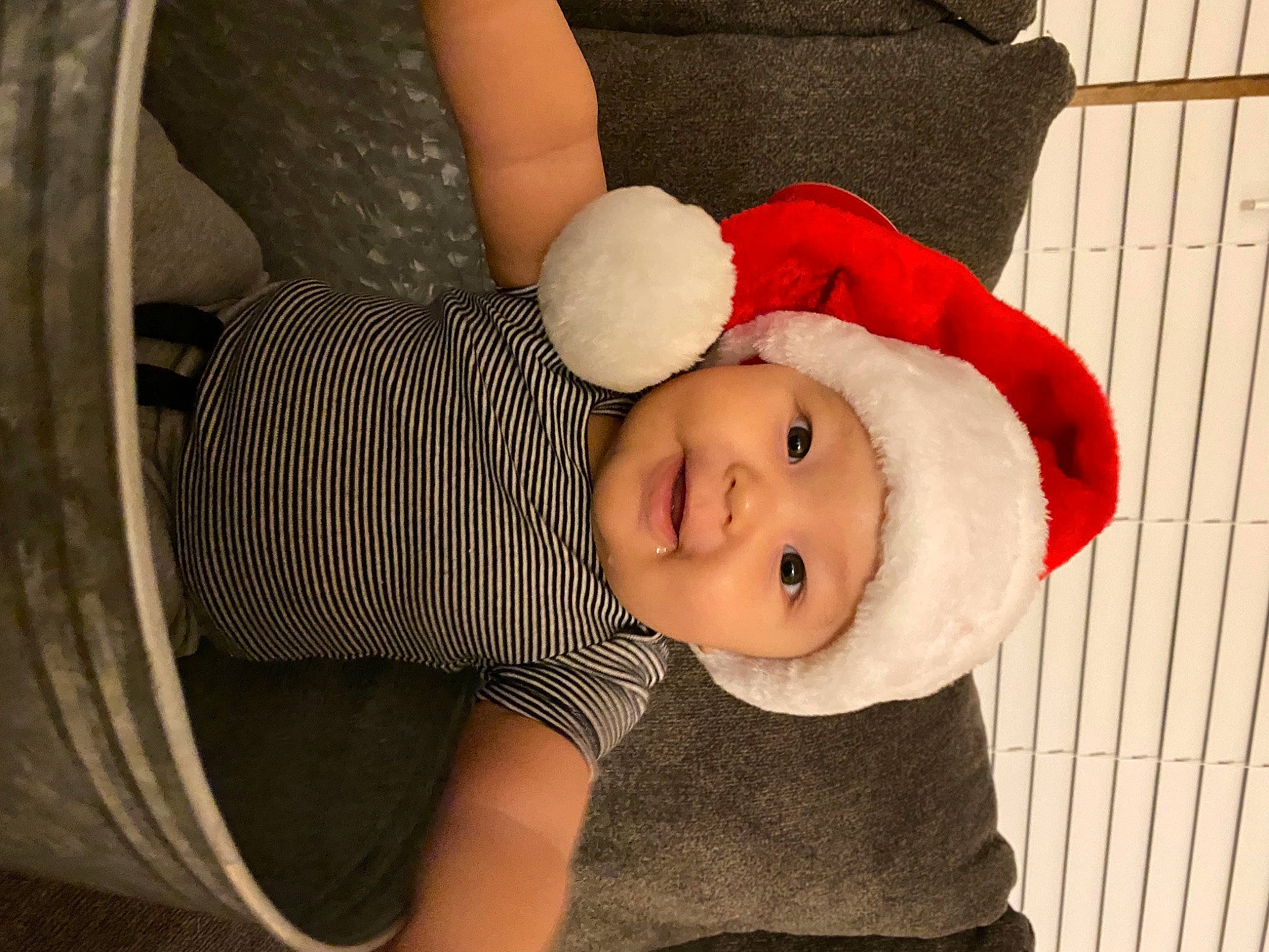 Leviticus is registered to the contest to win money with this photo: baby, baby_products, baby_toddler_clothing, christmas, comfort, costume_accessory, costume_hat, fictional_character, fur, headwear, human, person, plush, stuffed_toy, toddler