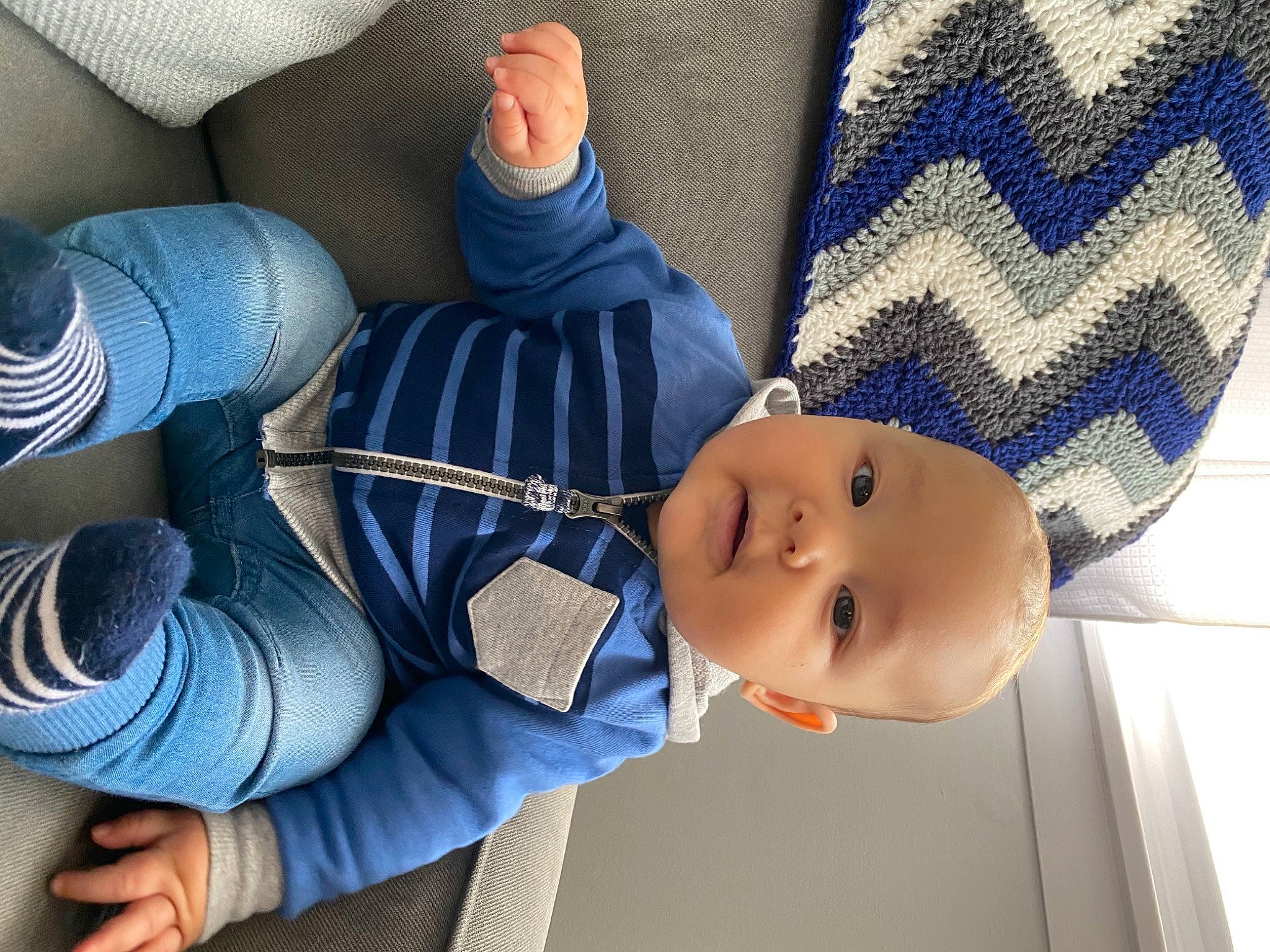 Leviticus is registered to the contest to win money with this photo: azure, baby, baby_products, baby_toddler_clothing, blue, cheek, child, comfort, electric_blue, person, product, textile, thumb, toddler, wool, woolen