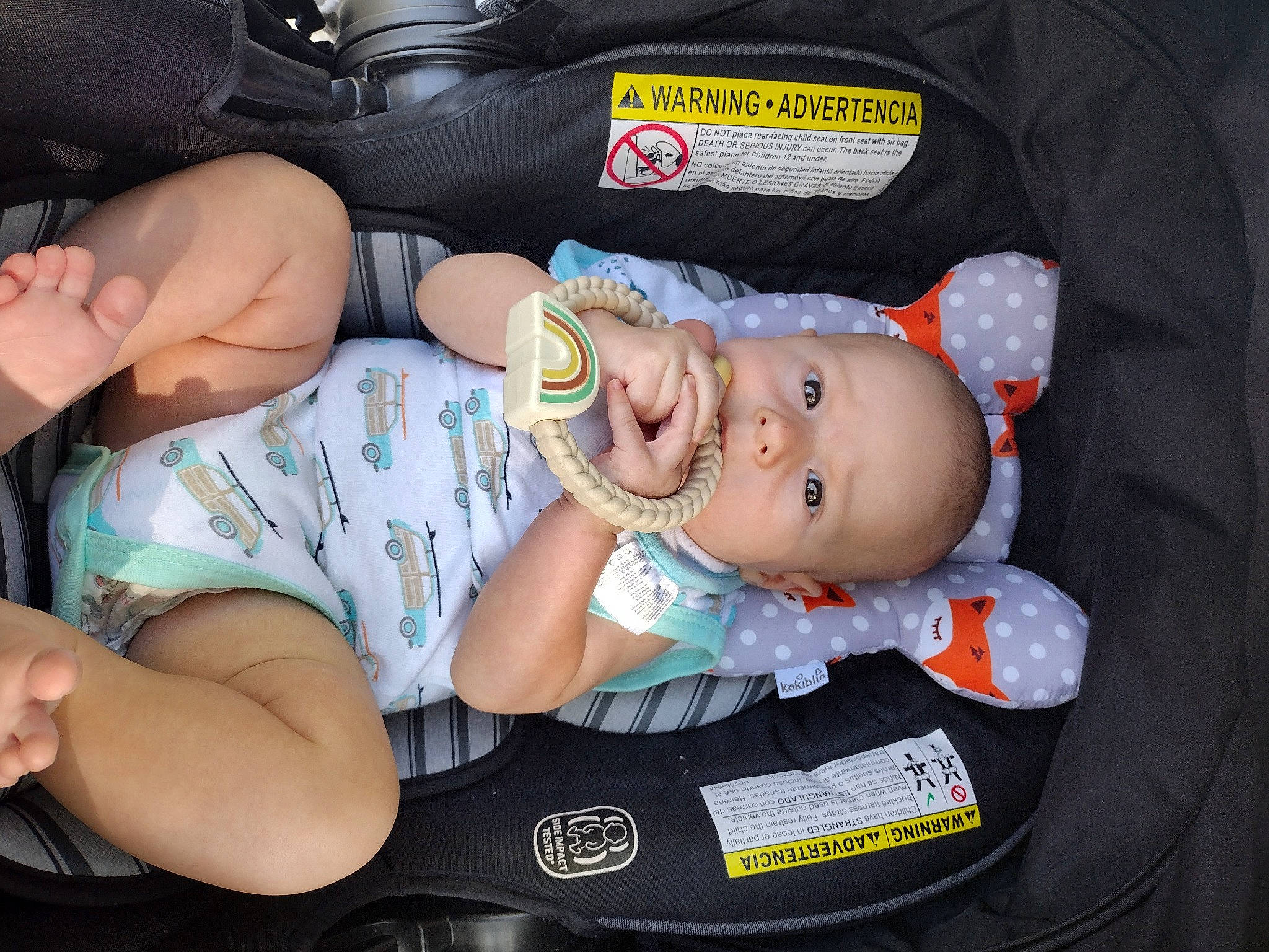 Tyson is registered to the contest to win money with this photo: baby, baby_carriage, baby_products, baby_toddler_clothing, car_seat, cheek, chest, child, comfort, elbow, fun, human_body, human_leg, knee, lap, mouth, person, shorts, skin, thigh