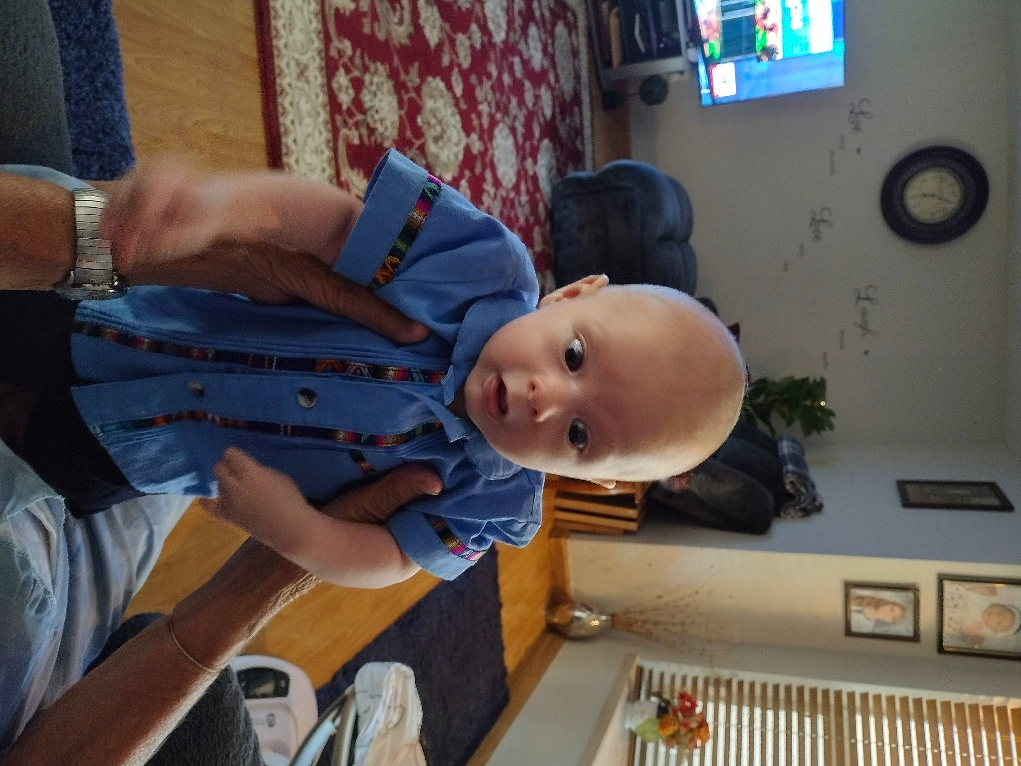 Tyson is registered to the contest to win money with this photo: baby, baby_products, baby_toddler_clothing, blurred, child, clock, curtain, finger, fun, hat, person, picture_frame, room, smile, television, toddler, watch