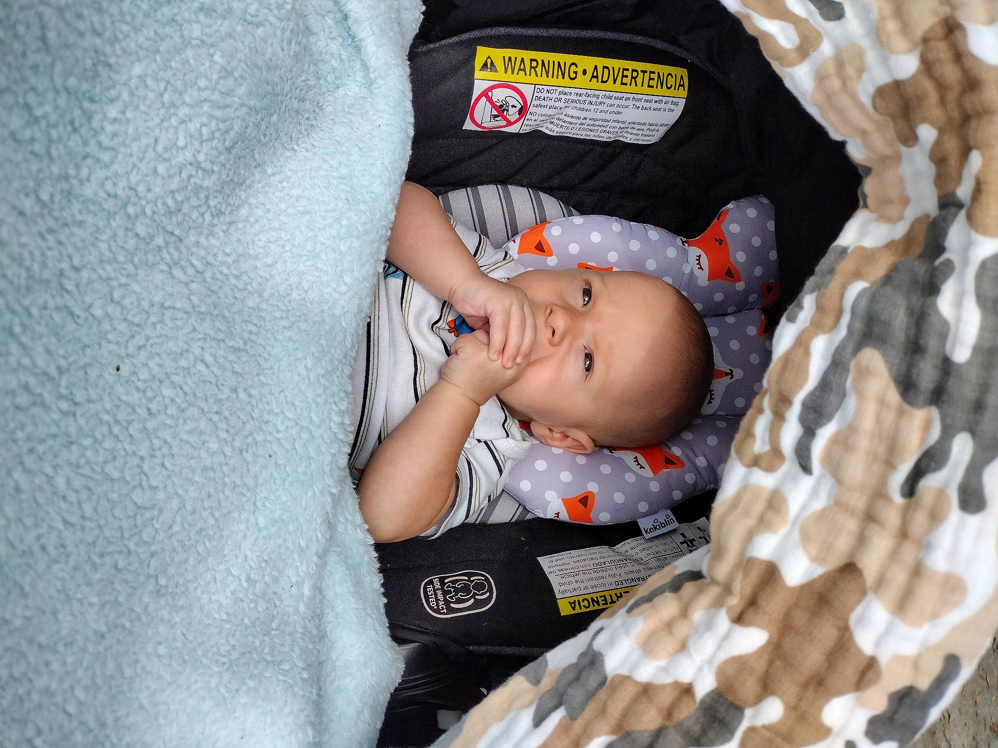 Tyson joined the competition — help win amazing prizes! arm, baby, baby_carriage, baby_products, baby_sleeping, baby_toddler_clothing, child, comfort, eye, finger, grass, grey, hand, linens, pattern, person, sitting, skin, sleeve, textile