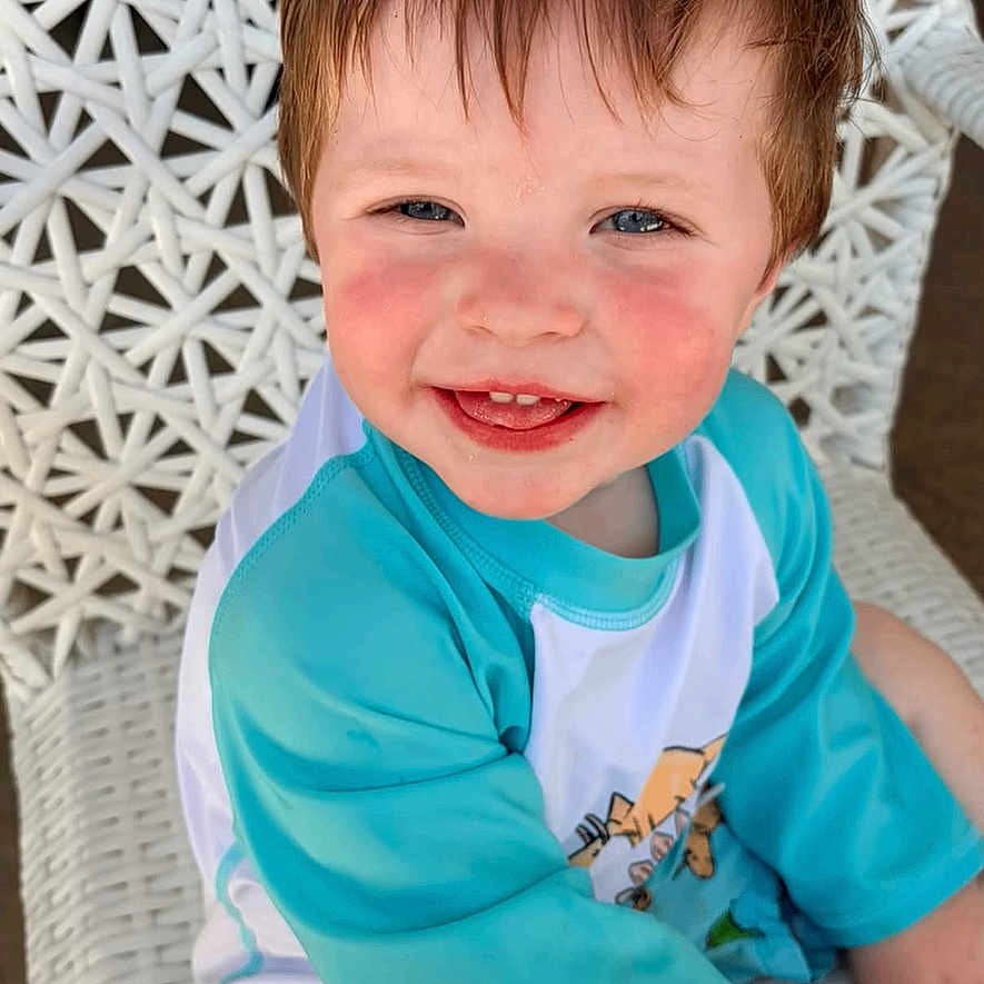 Steven joined the competition — help win amazing prizes! toddler, child, smiling, blue_shirt, shorts, white_chair, woven_chair, happy, outdoor, cute, face, rosy_cheeks, sitting, young_child, portrait, casual_clothing, daylight, skin, hair, text_overlay