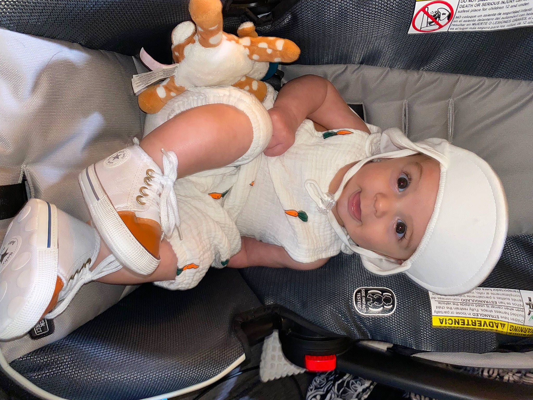 Montgomery joined the competition — help win amazing prizes! baby, baby_carriage, baby_products, baby_toddler_clothing, carmine, child, costume, doll, hat, head, headwear, human_leg, lap, leg, person, personal_protective_equipment, room, smile, stuffed_toy, thigh