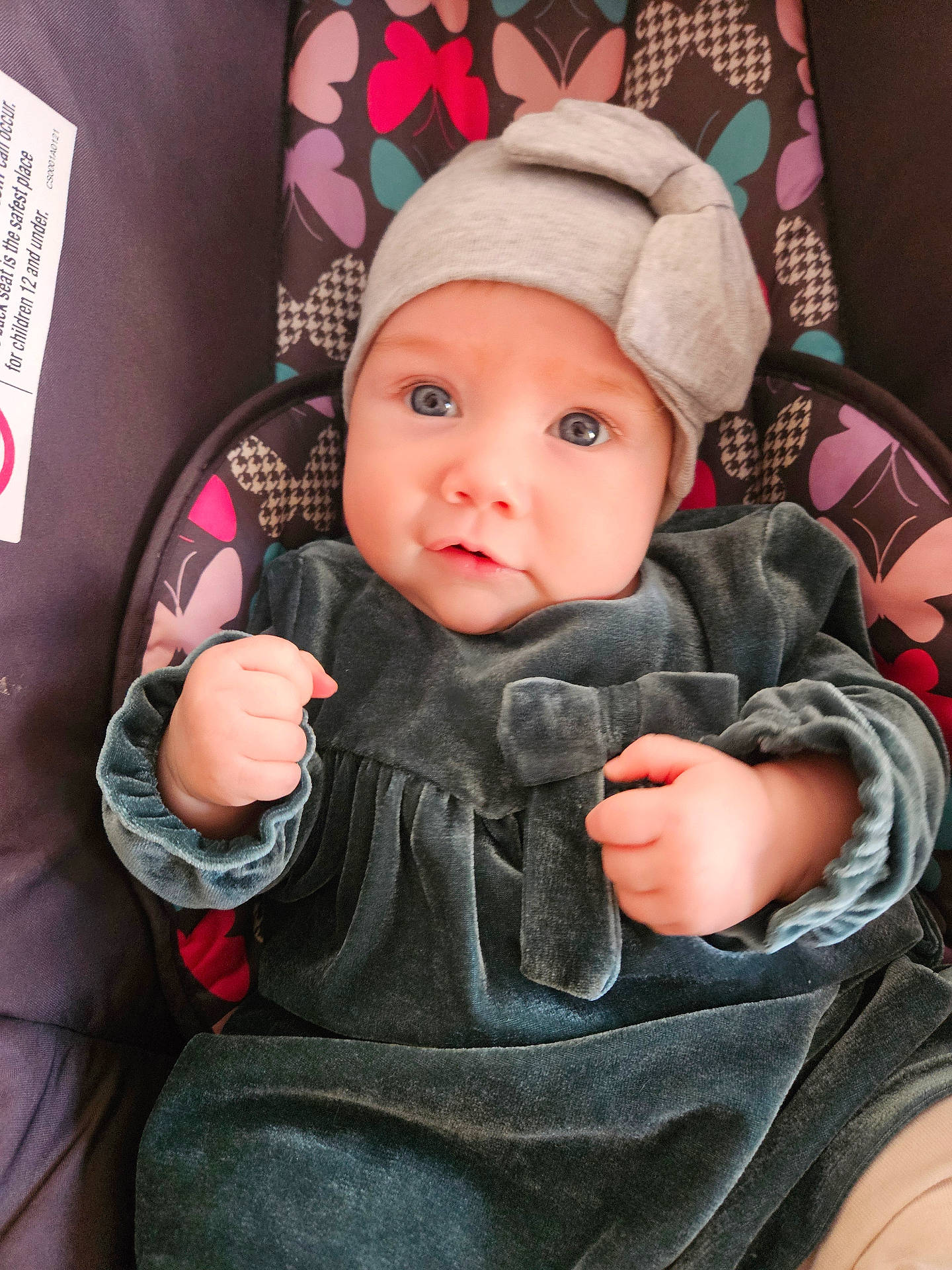 Elena joined the competition — help win amazing prizes! baby, blanket, bodypart, bonnet, cap, clothing, face, finger, furniture, hand, hat, head, hood, hoodie, knitwear, pants, person, photography, portrait, sweater