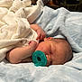Kal-El joined the competition — help win amazing prizes! newborn, baby, sleeping, pacifier, blanket, blue_blanket, white_blanket, infant, peaceful, cozy, soft_texture, indoors, bedroom, resting, skin, head, hand, portrait, child, comfort