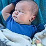 baby, sleeping, blanket, blue_shirt, infant, soft_texture, cute, peaceful, relaxed, face, head, arm, skin, closeup, portrait, child, indoor, cozy, warm, toddler