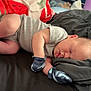 Kal-El is registered to the contest to win money with this photo: baby, newborn, sleeping, infant, onesie, mittens, blanket, pillow, bed, soft, peaceful, cute, child, rest, indoors, closeup, portrait, skin, small, toddler