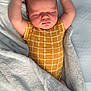 baby, sleeping, arms_up, blanket, yellow_clothing, onesie, soft_texture, infant, peaceful, cozy, bed, resting, child, cute, newborn, portrait, indoor, sleepwear, relaxing, toddler