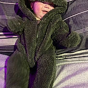 Brantley joined the competition — help win amazing prizes! baby, blanket, bonnet, cap, clothing, coat, face, glove, hat, head, hood, hoodie, jacket, knitwear, person, photography, portrait, purple, sweater, sweatshirt