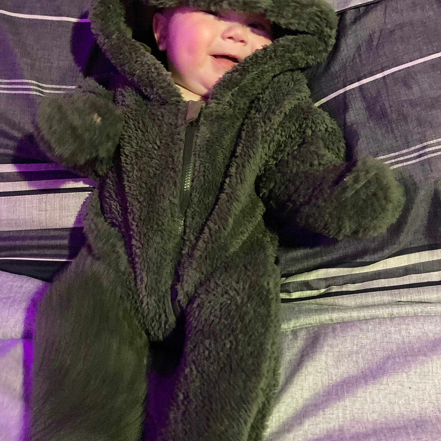 Brantley joined the competition — help win amazing prizes! baby, blanket, bonnet, cap, clothing, coat, face, glove, hat, head, hood, hoodie, jacket, knitwear, person, photography, portrait, purple, sweater, sweatshirt