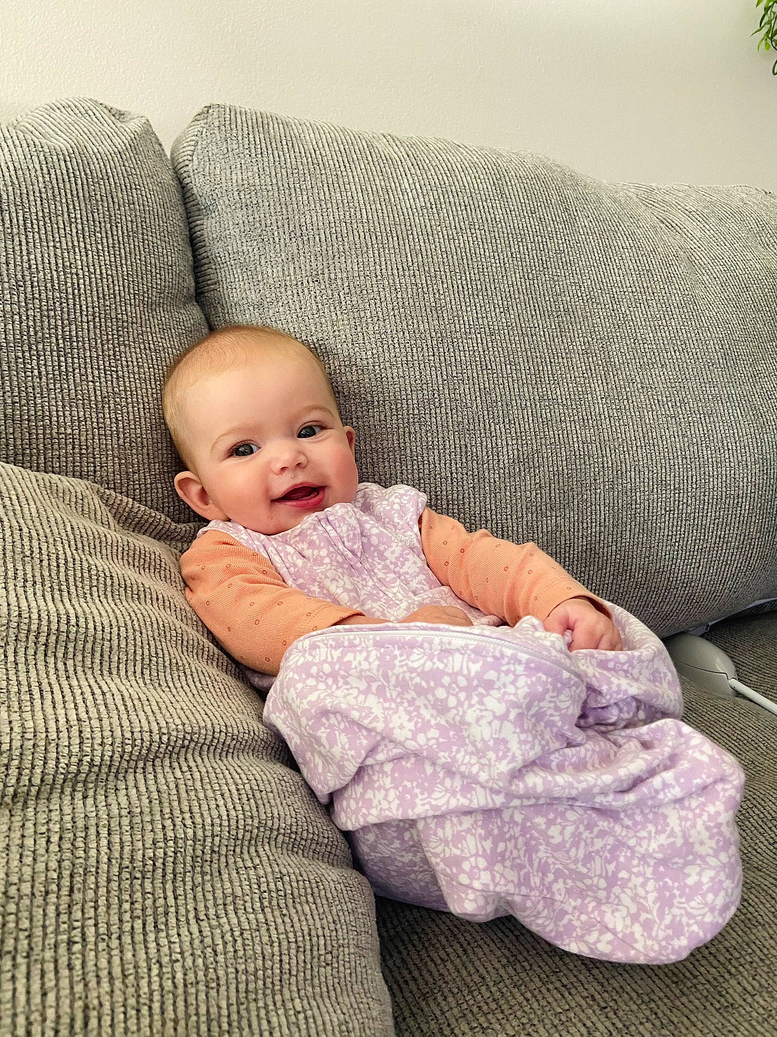 Lennon joined the competition — help win amazing prizes! baby, baby_toddler_clothing, bedding, cheek, child, comfort, couch, flooring, foot, fur, human_leg, linens, pattern, person, room, sitting, skin, sleeve, throw_pillow, toddler