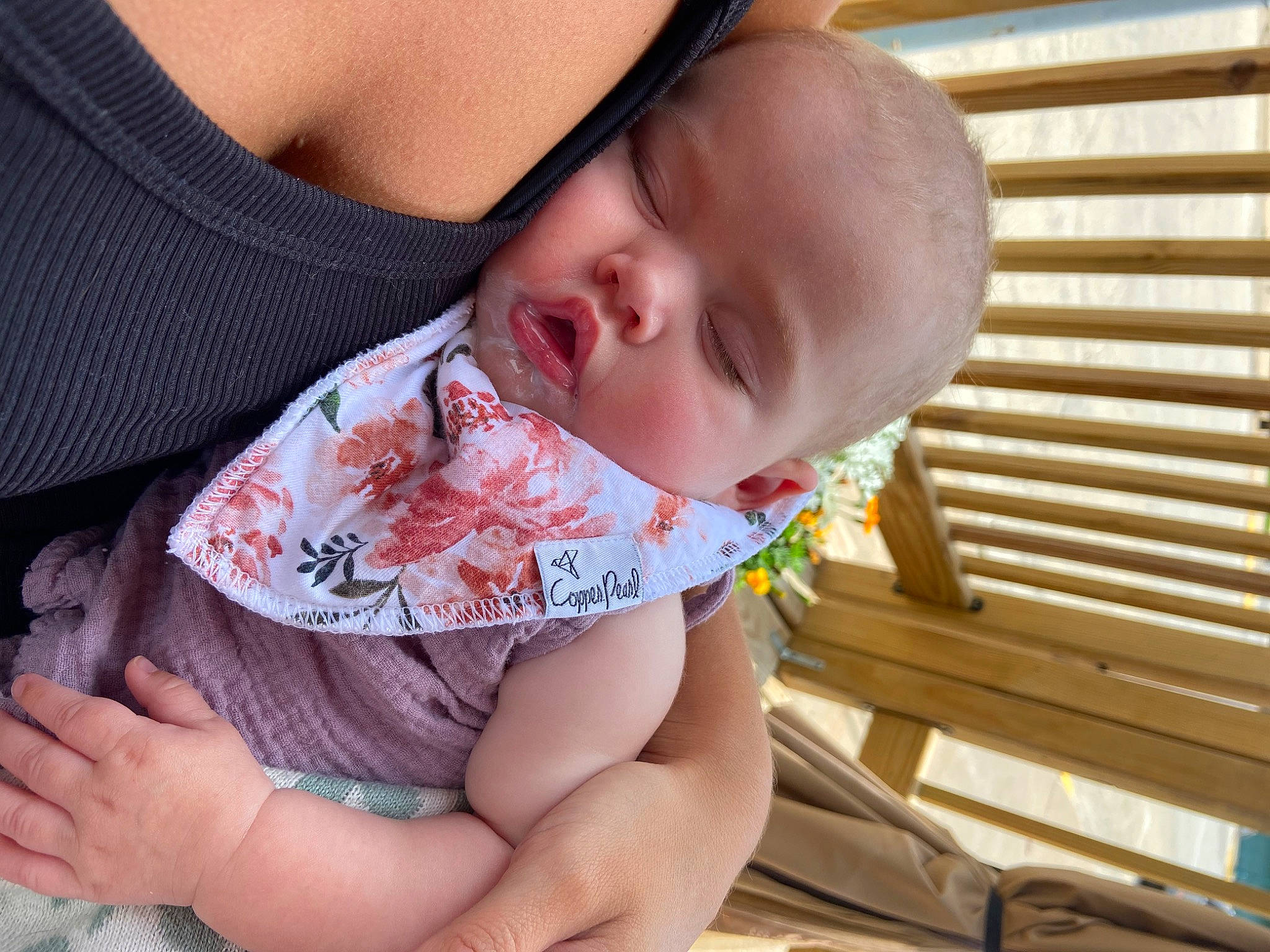 Lennon is registered to the contest to win money with this photo: baby, baby_toddler_clothing, cheek, child, collar, comfort, finger, happy, human_leg, mouth, nail, neck, nose, pattern, person, sitting, skin, sleeve, thumb, toddler