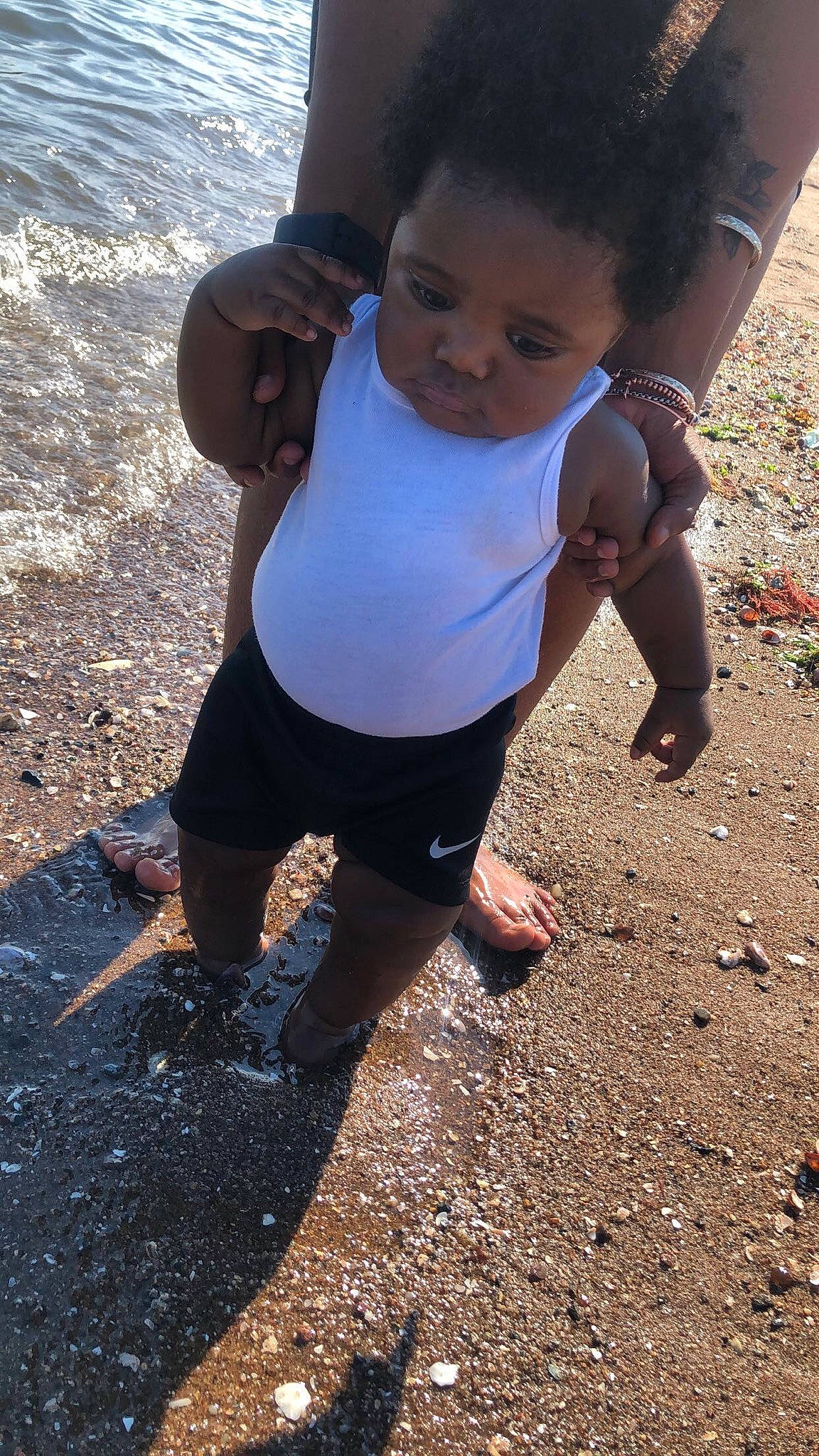 Jaylon is registered to the contest to win money with this photo: asphalt, barefoot, chest, electric_blue, foot, fun, happy, head, human_leg, knee, leisure, people_in_nature, person, recreation, road_surface, sand, soil, thigh, toddler, trunk
