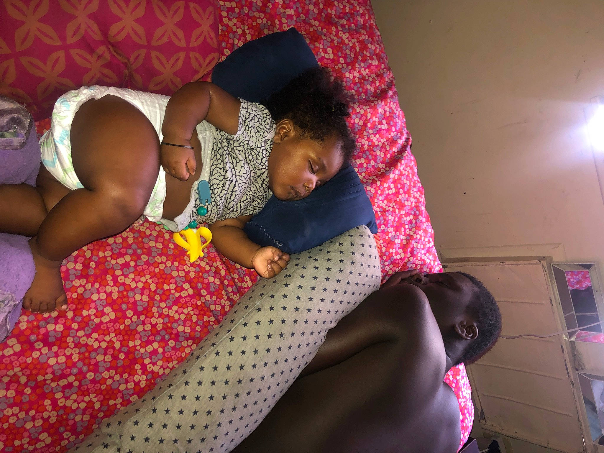 Jaylon joined the competition — help win amazing prizes! abdomen, barefoot, black_hair, child, comfort, elbow, flooring, fun, happy, human_leg, knee, leisure, linens, magenta, mouth, pattern, person, pink, thigh, toddler