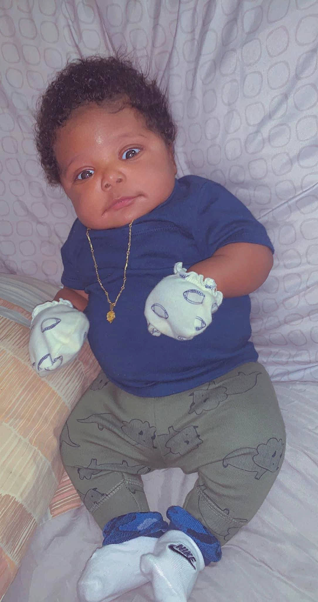 Jaylon joined the competition — help win amazing prizes! arm, baby, baby_toddler_clothing, blue, cheek, child, comfort, elbow, eye, hairstyle, head, human_body, mouth, neck, nose, person, shoulder, skin, sleeve, t_shirt