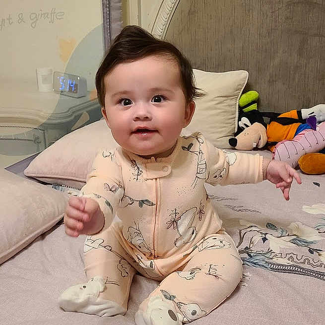 Bella joined the competition — help win amazing prizes! baby, babylaughing, bodypart, clothing, crawling, cushion, face, hair, happy, head, homedecor, hosiery, pajamas, person, photography, portrait, sitting, sleeve, smile, sock
