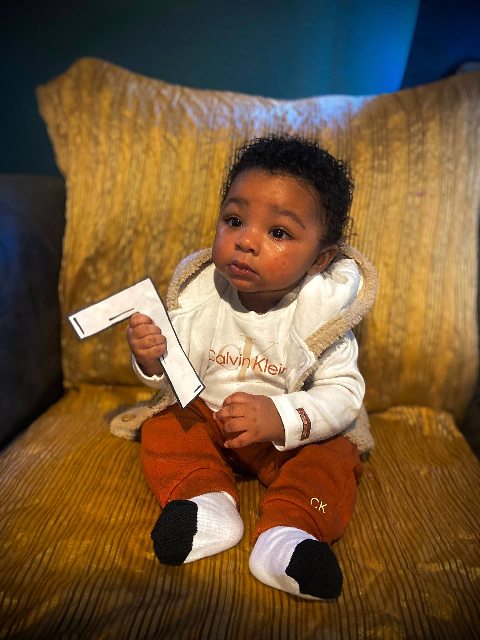 Armonie is registered to the contest to win money with this photo: baby, baby_toddler_clothing, beauty, cheek, child, comfort, couch, face, floor, flooring, fun, happy, hardwood, head, human, living_room, people, person, sitting, toddler