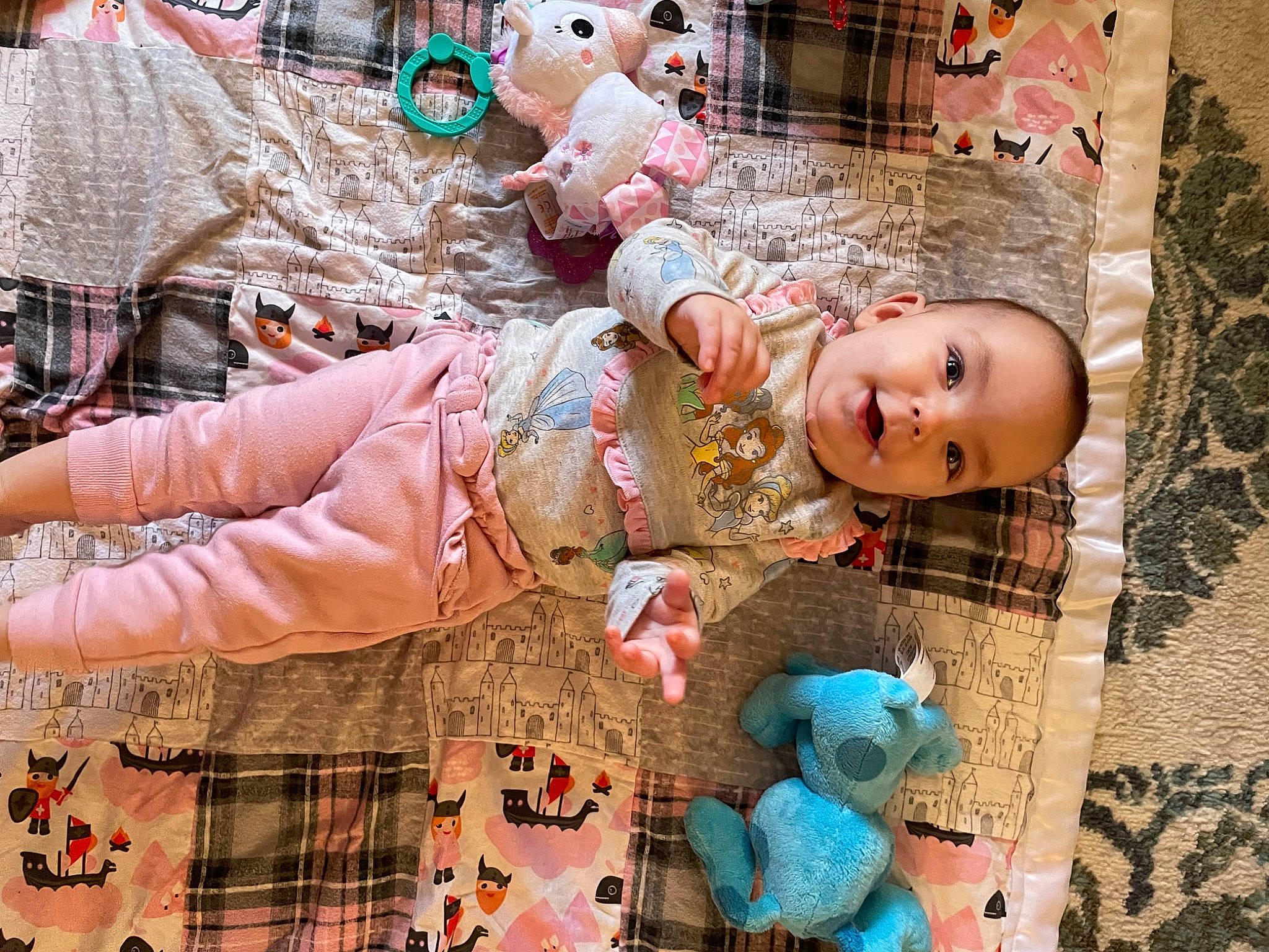 Reagan is registered to the contest to win money with this photo: child, craft, doll, fashion_accessory, green, happy, linens, pattern, person, pink, plaid, room, smile, street_fashion, textile, thread, toddler, toy, wood, wool