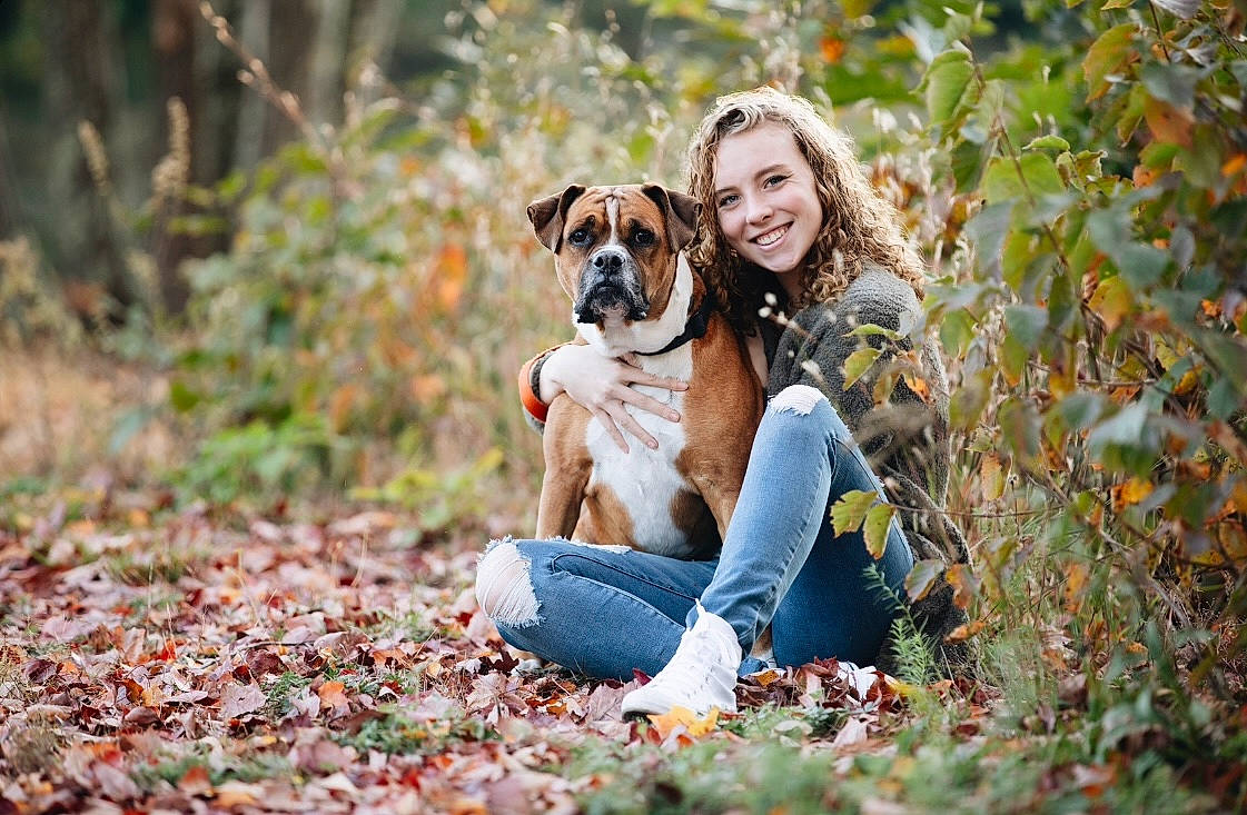 Tanner joined the competition — help win amazing prizes! brown_hair, canidae, carnivore, companion_dog, dog, dog_breed, fawn, forest, grass, happy, jeans, leaf, leisure, people_in_nature, plant, sitting, smile, sporting_group, sunglasses, woodland
