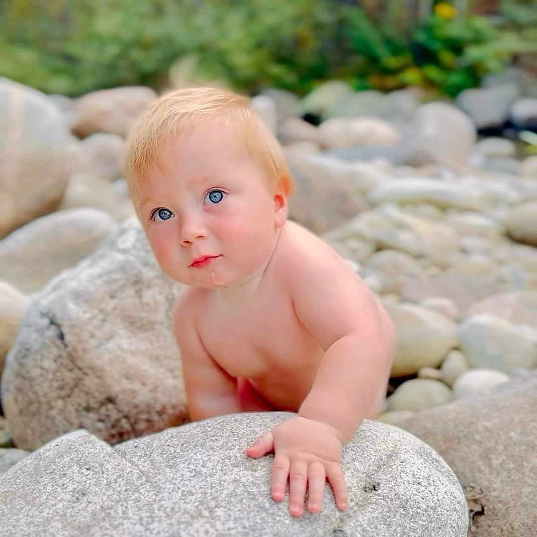 Forrest joined the competition — help win amazing prizes! baby, blonde, bodypart, crawling, face, finger, hair, hand, happy, head, nature, outdoors, pebble, person, photography, plant, portrait, rock, sitting, vegetation