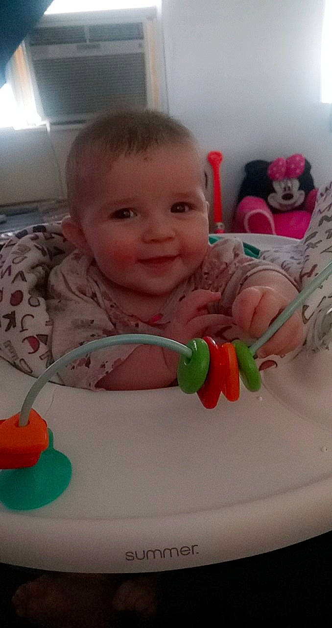 Elliana is registered to the contest to win money with this photo: baby, cheek, child, eating, face, food, head, person, play, product, room, skin, smile, toddler