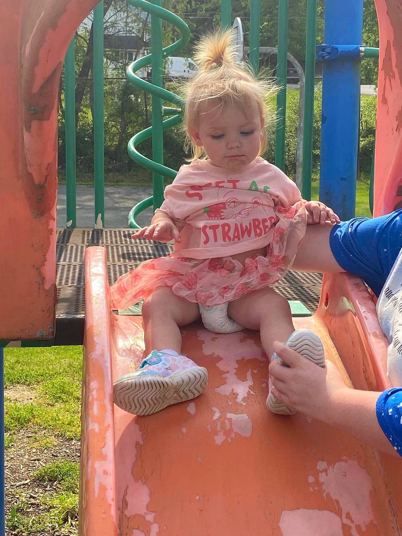 Layla joined the competition — help win amazing prizes! baby, baby_toddler_clothing, child, city, fun, grass, happy, leisure, outdoor_play_equipment, person, pink, plant, play, playground, public_space, recreation, shorts, sitting, summer, toddler