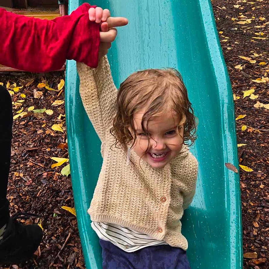 Lucille joined the competition — help win amazing prizes! animal, canine, child, clothing, dog, face, female, girl, grass, head, outdoors, pants, person, pet, photography, playarea, portrait, slide, sliding, toy