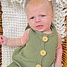 Owen Swartz joined the competition — help win amazing prizes! baby, infant, child, portrait, lying_down, green_romper, knitted_blanket, wicker_basket, wide_eyes, tongue_out, calm, indoor, close_up, fashion, buttons, soft_lighting, textile, nursery, cute, photography