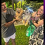 Luna is registered to the contest to win money with this photo: person, dog, pomeranian, outdoor, night, grass, smile, happy, exchange, greenery, park, animal, pet, leash, dress, shorts, bag, trees, light, holding