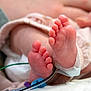 Brinley is registered to the contest to win money with this photo: newborn, baby, feet, toes, hospital, medical, monitoring, wire, skin, closeup, infant, healthcare, patient, delicate, small, cute, footwear_absent, sleeping, blanket, clothing