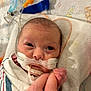 Brinley joined the competition — help win amazing prizes! newborn, baby, hospital, medical_equipment, breathing_tube, hand, finger, blanket, swaddle, infant, person, face, skin, bed, healthcare, closeup, cute, fragile, care, love